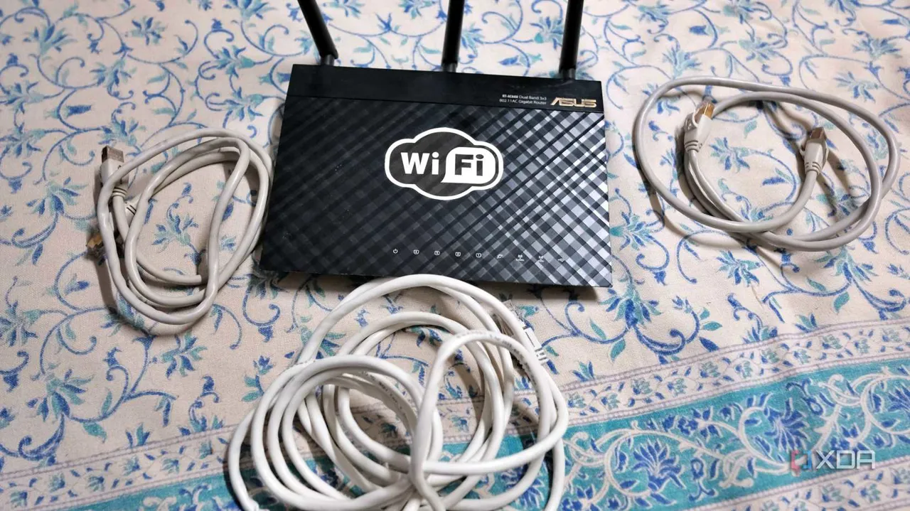 Old router with cables on the floor