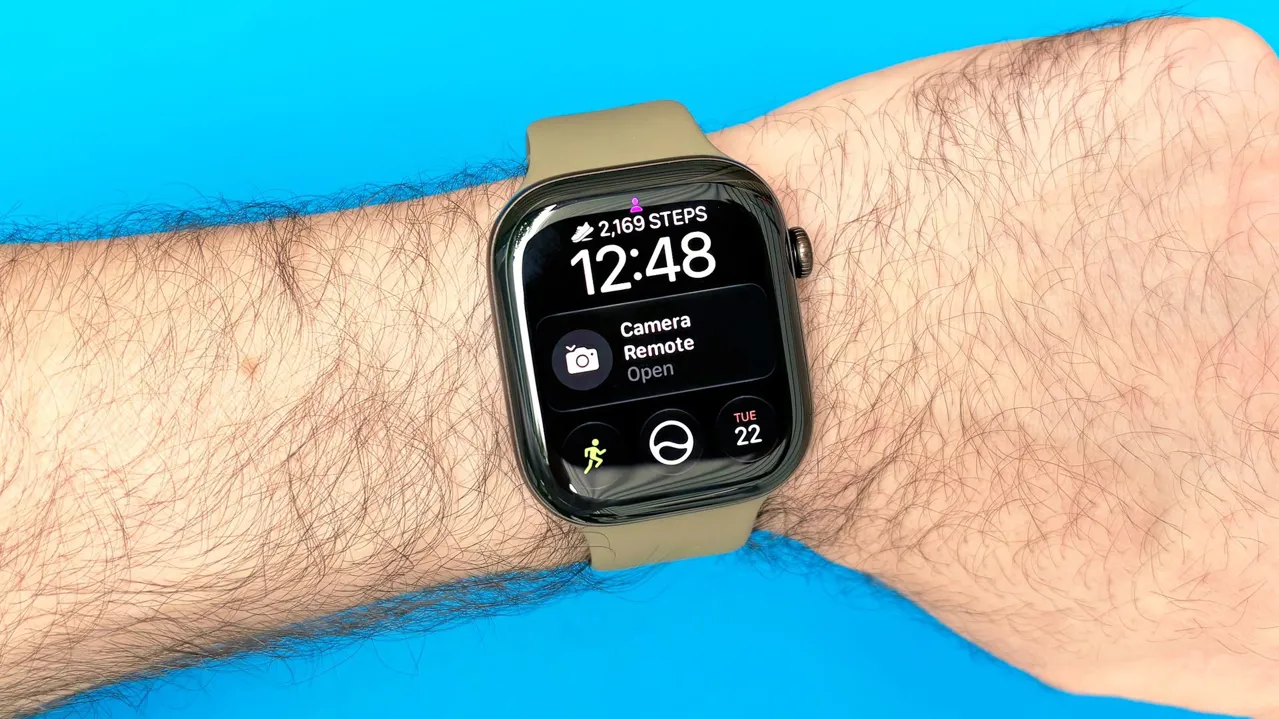 Close-up of the Apple Watch 12 on a user's wrist with the step count widget shown on the watch face