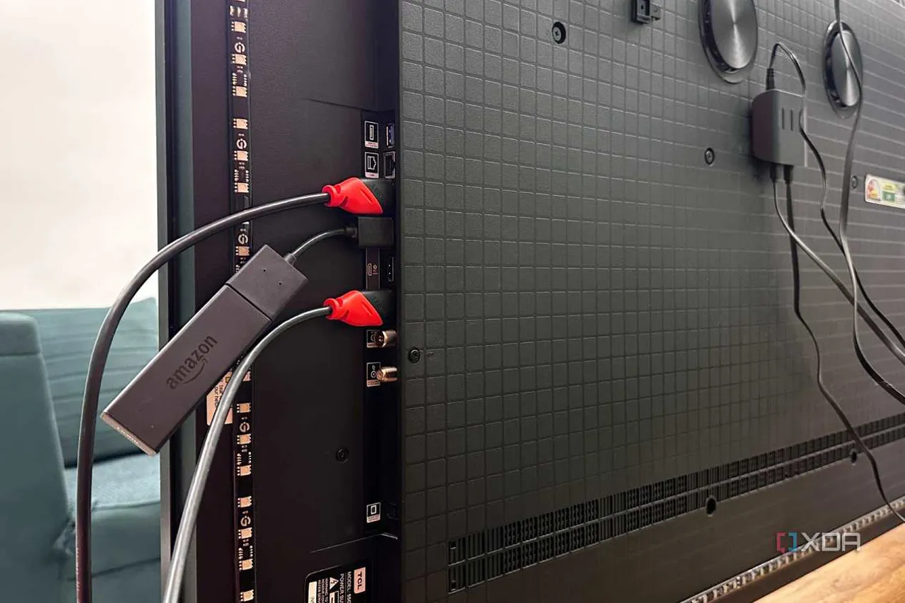 HDMI cables plugged into the ports on a 4K TV.